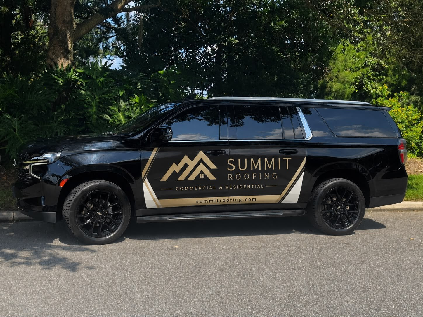 Black SUV with example dual-door branding in Orlando